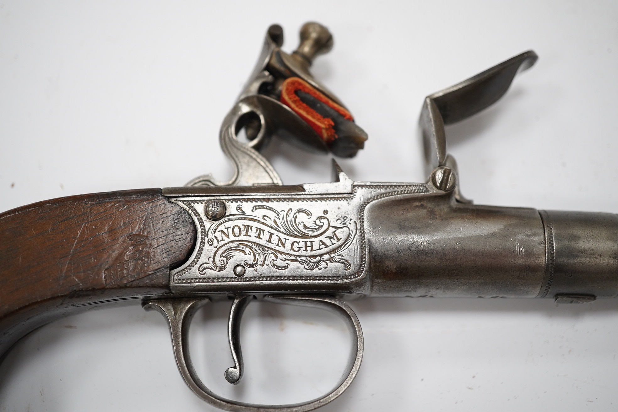 A cannon barrel flintlock boxlock travelling pistol by R. Daykin of Nottingham, with turn off cannon barrel, Tower private proof marks, signed frame upon foliate engraved background, slab walnut grip and sliding trigger